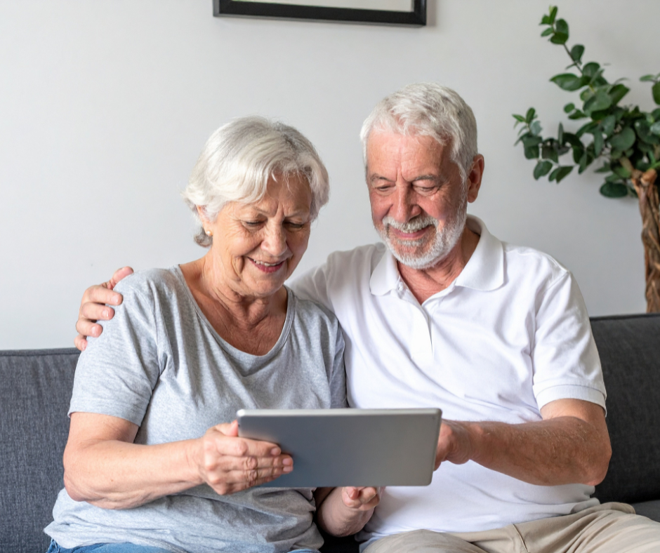 Mobile Doctors vs Telemedicine: What’s Better for Seniors? 1 Senior couple using a tablet for a telemedicine virtual doctor visit at home in a comfortable living room setting
